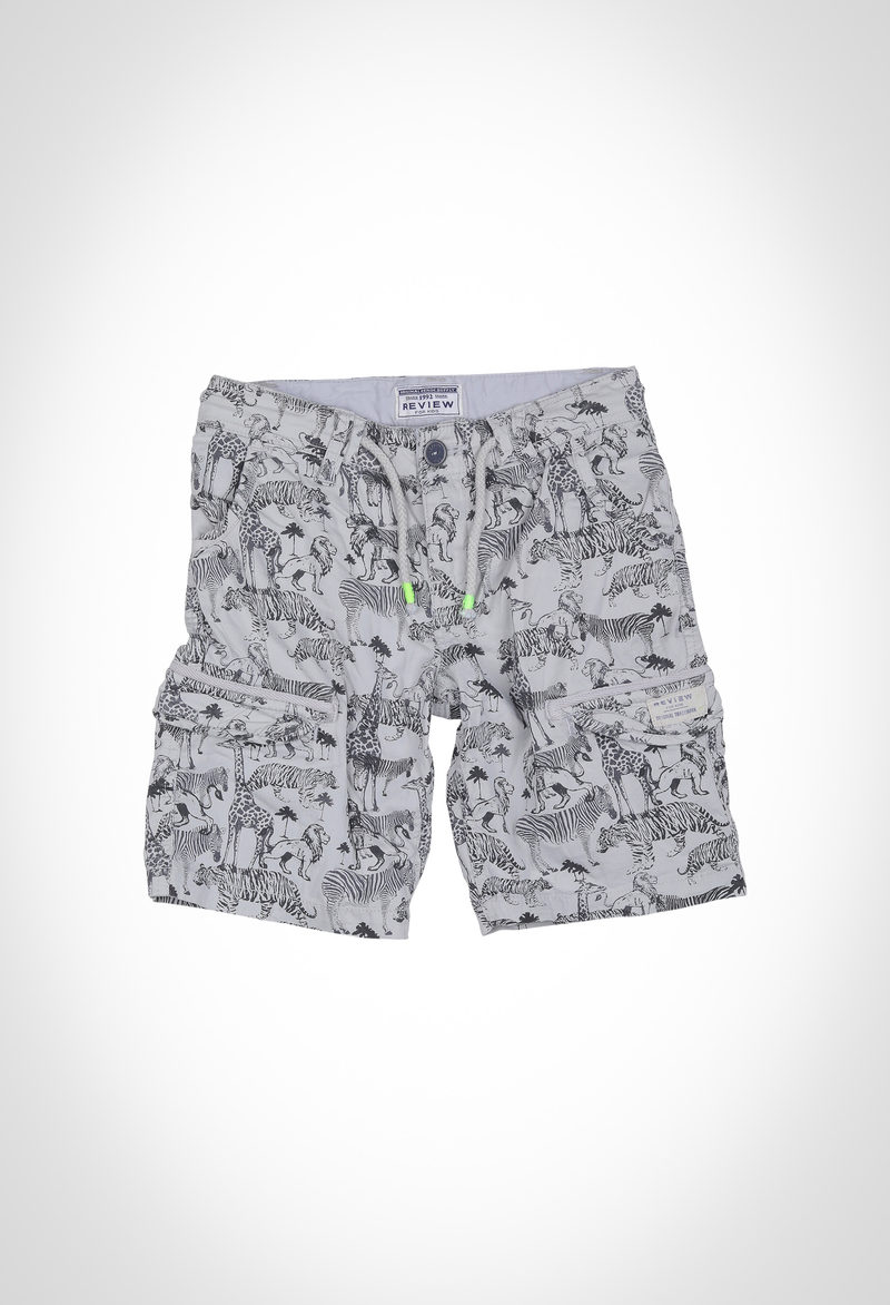 Heavy enzymed washed boys cargo shorts in cotton elastane aop twill